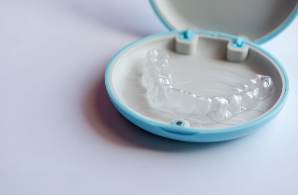 A close-up of invisalign in a blue case.