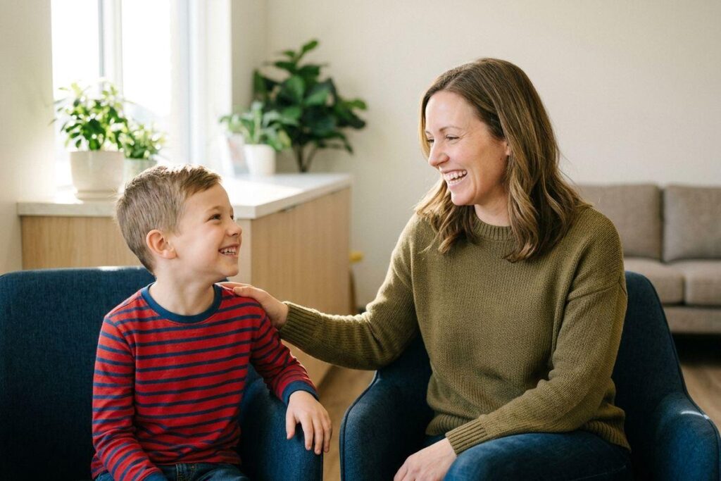 A smiling parent and child showing their healthy teeth during a dental visit.